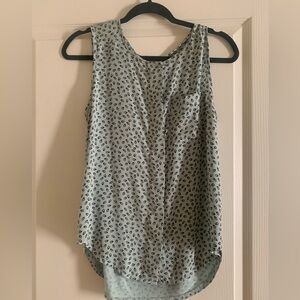 No sleeve teal blouse with navy accents